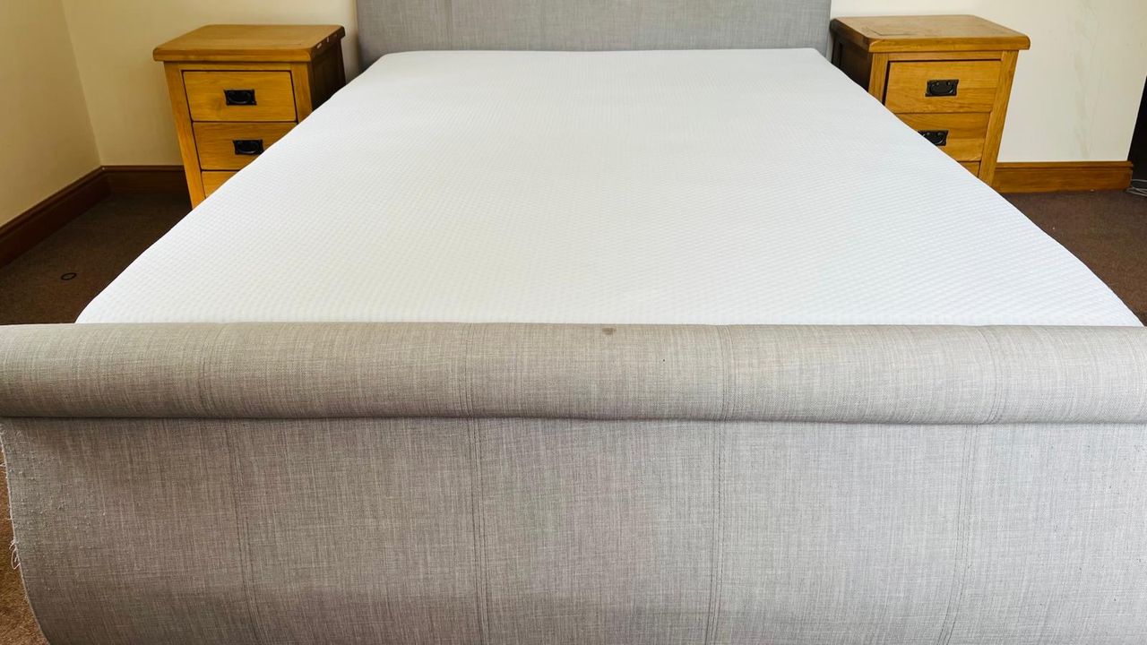 The Emma NextGen Cooling Mattress on a bed frame in our reviewer's bedroom