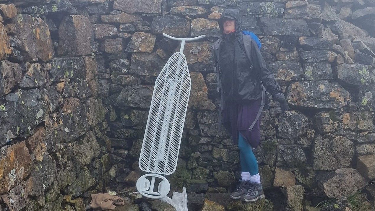 A woman with an ironing board