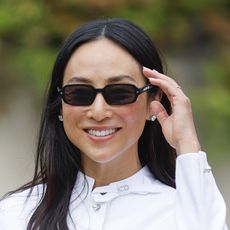 Greta Lee wearing a white set