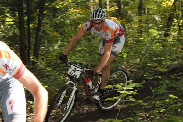 Darrin Braun (Adventure 212 / Specialized) follows teammate Chris Peariso through the singletrack at the WORS Bear Paw Rock N' Roll.
