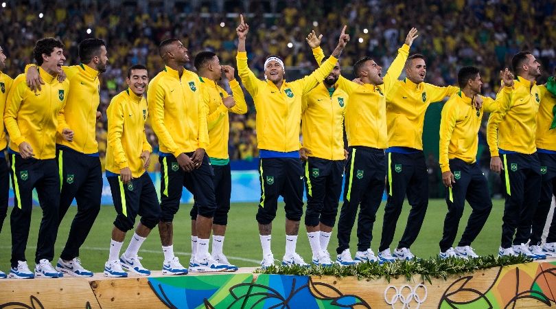 Brazil players celebrate with the gold medals after winning the men&#039;s football tournament at the Rio de Janeiro Olympics in 2016.