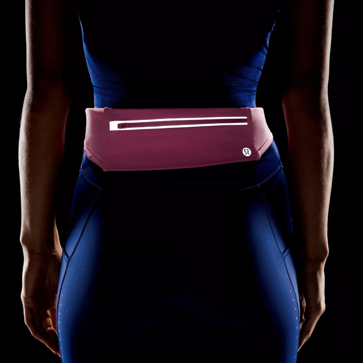 model wearing pink lululemon running belt