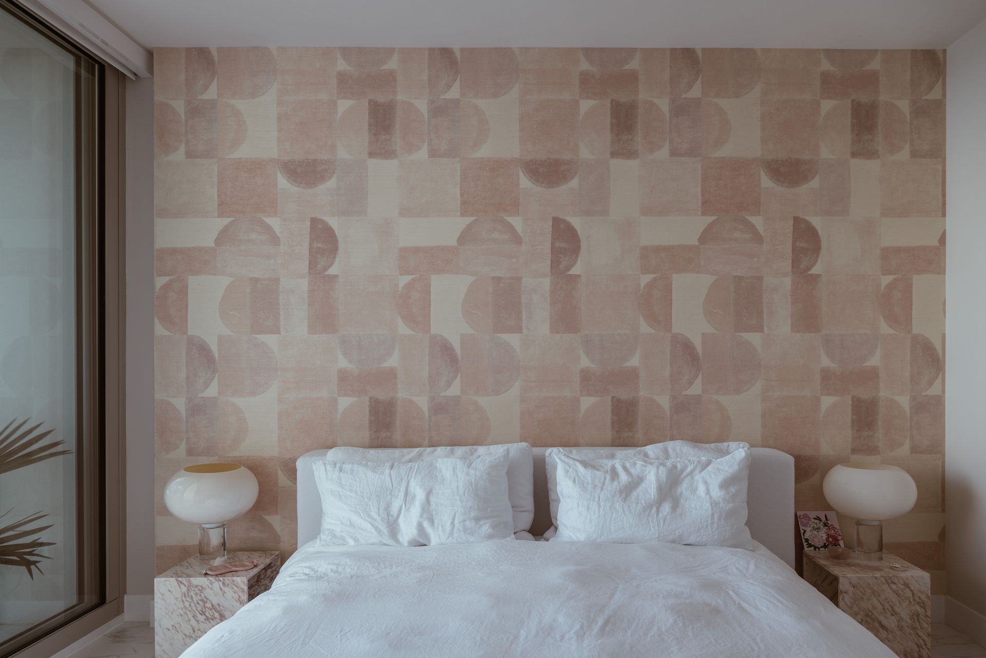 A bedroom in many shades of peach and pink