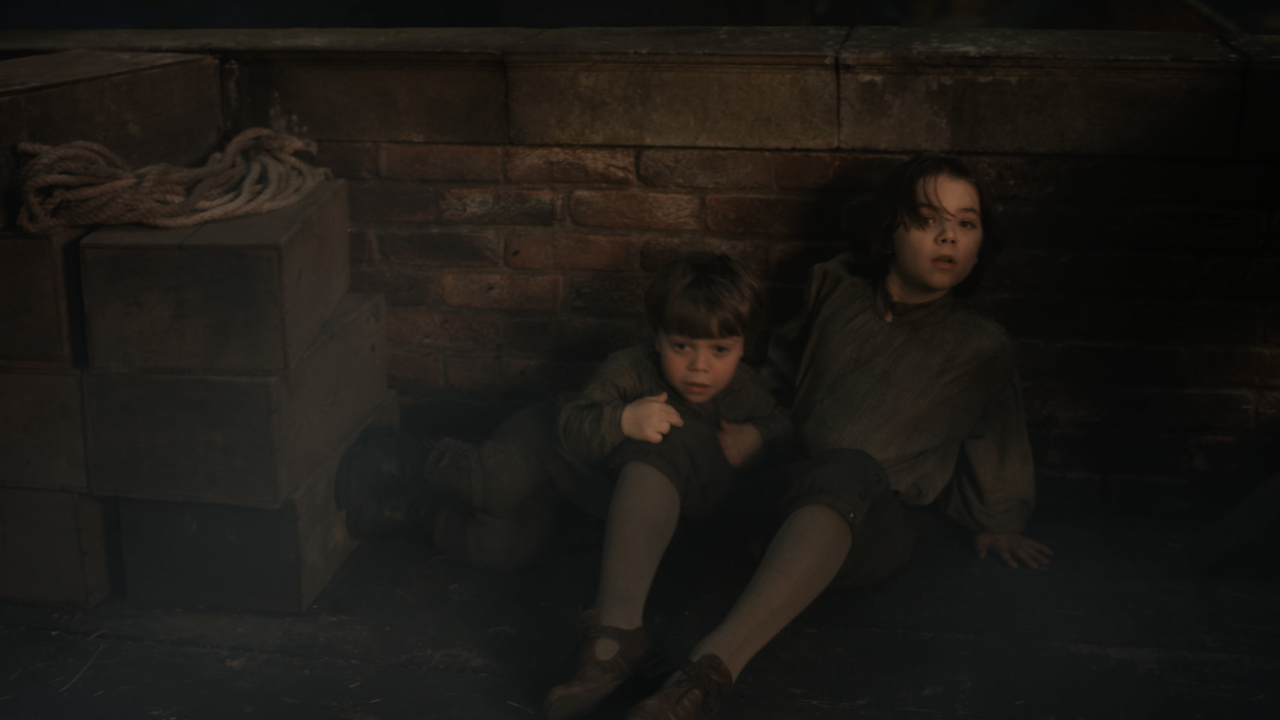 Fergus and Marsali's kids on the roof of a burning building in Outlander's Season 8 trailer