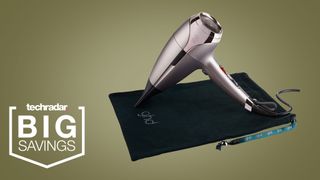 The GHD Helios in Pewter on a khaki background