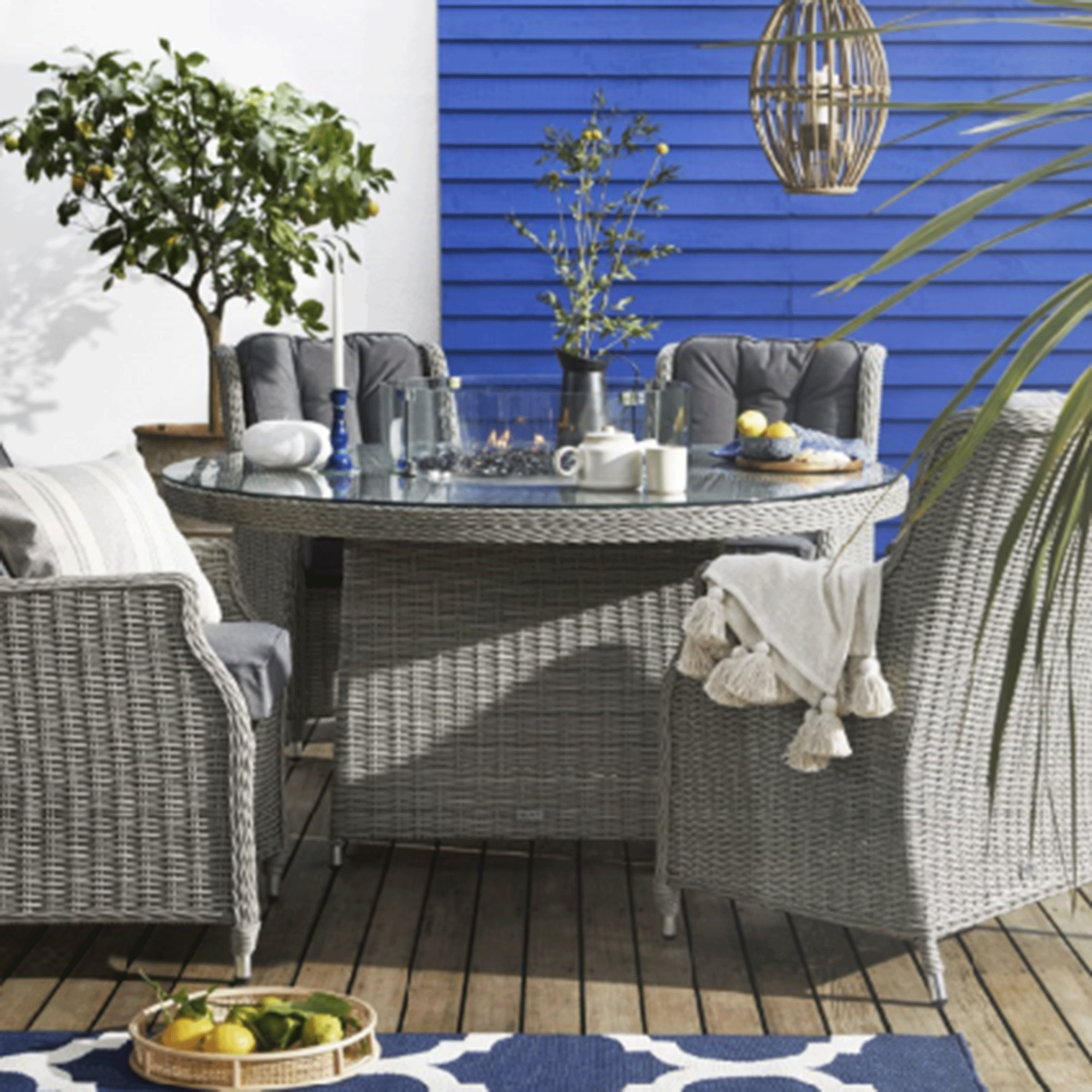 Blue wall with wicker furniture