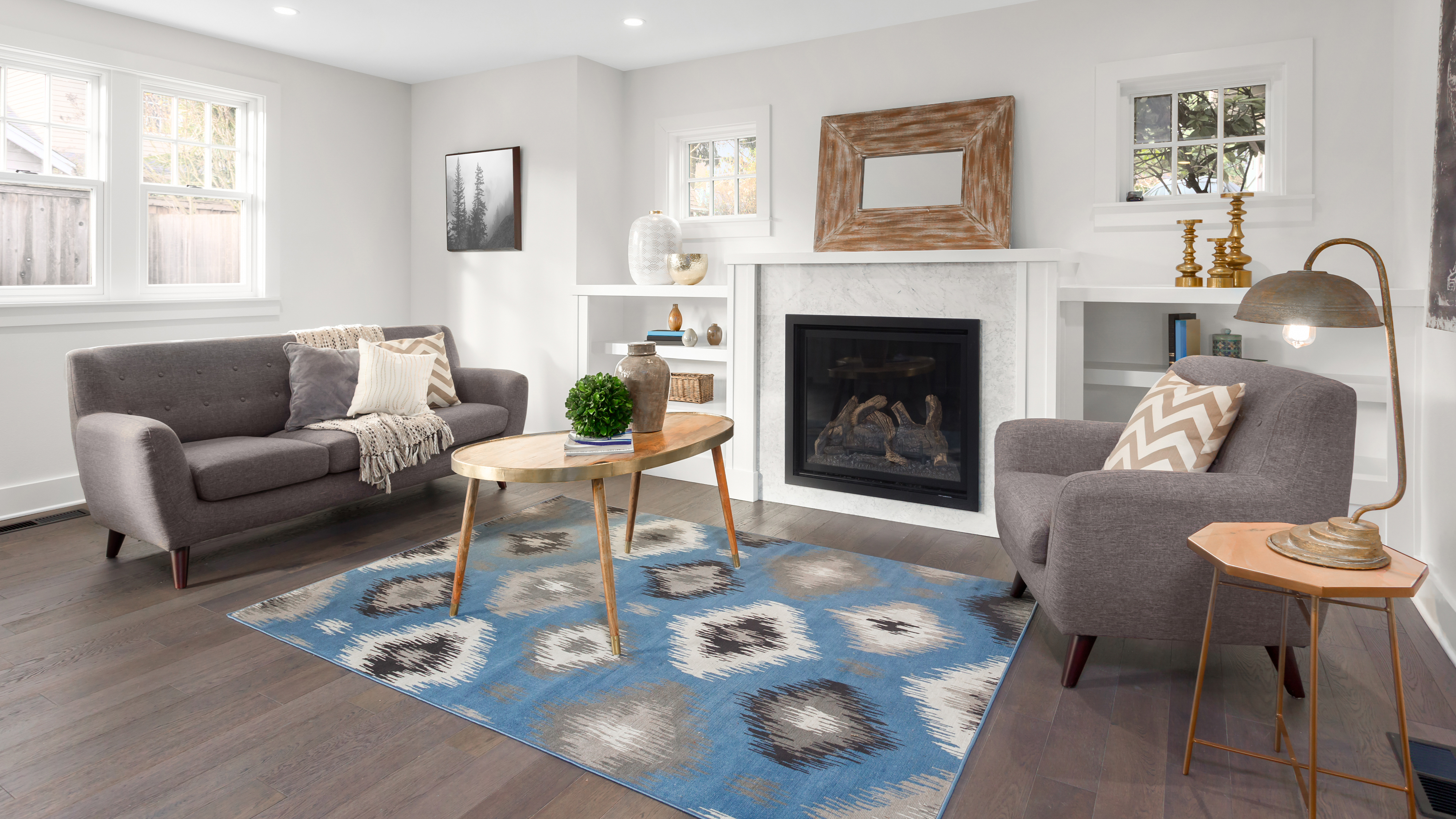 Blue carpet in the center of the living room floor