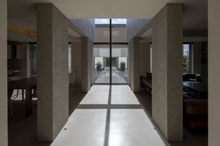 View through modern concrete japanese house by maniera architects