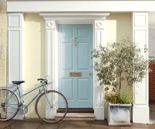 pale blue front door on townhouse