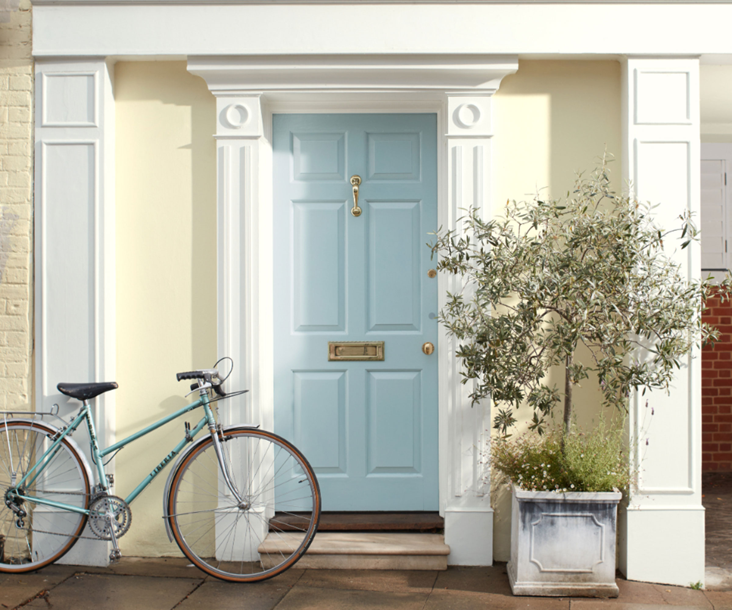 pale blue front door on townhouse