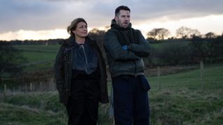 Moira and Ross talking in a field