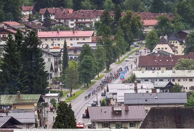 The peloton races on its way to the finish line of stage two