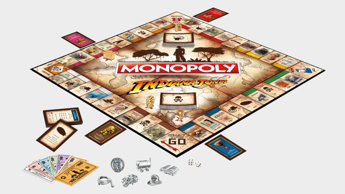 Monopoly: Indiana Jones Edition board, tokens, cards, and money on a plain background