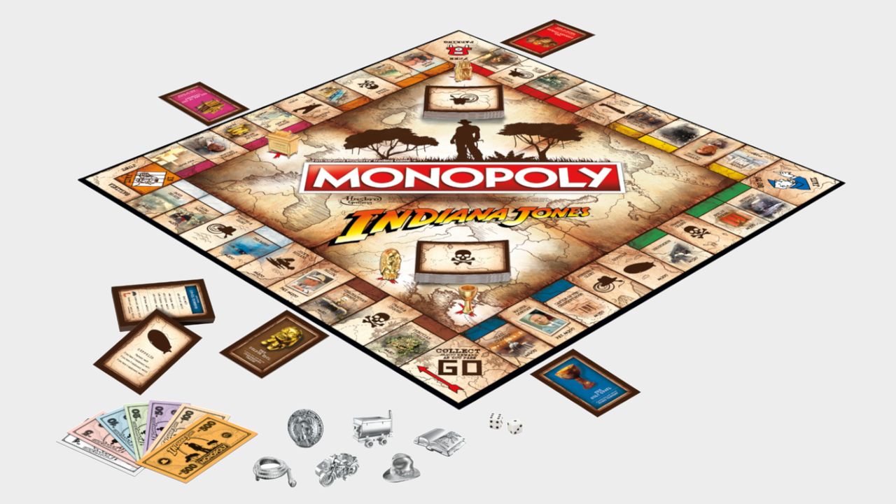 Monopoly: Indiana Jones Edition board, tokens, cards, and money on a plain background