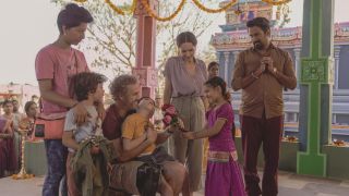 Lucca receiving flowers while in India