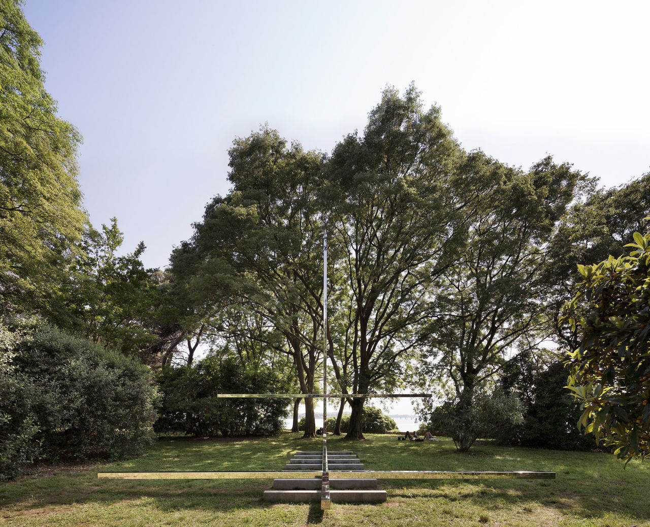 Steel cross in a green area