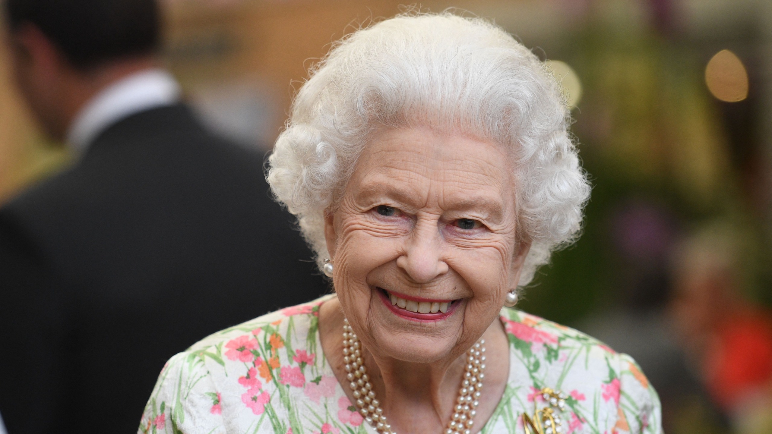 Queen Elizabeth II smiles as she attends an event in celebration of 'The Big Lunch' initiative at The Eden Project, near St Austell in south west England on June 11, 2021