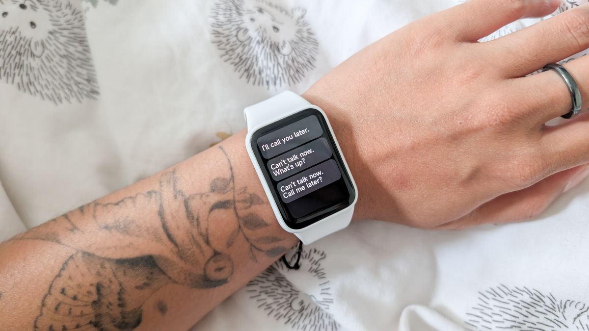 A person wearing a Xiaomi Smart Band 10 Pro smartwatch
