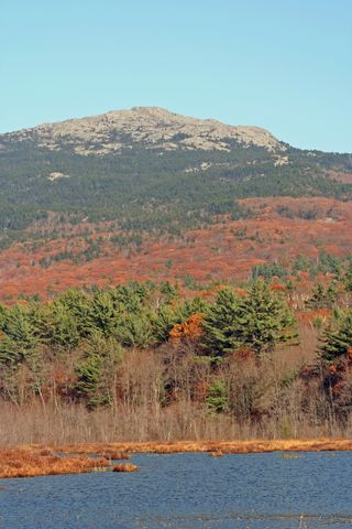 Fall leaves enliven the region around New Hampshire's Mount Monadnock.