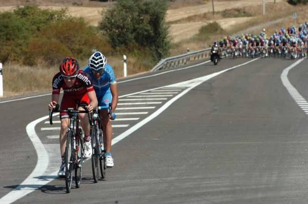 The last two riders from the break press on