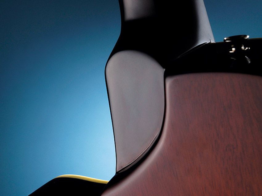 A sculpted heel aids top-fret access.