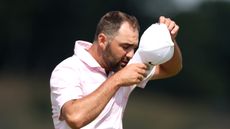 Scottie Scheffler takes off his cap after missing the cut at the Genesis Scottish Open