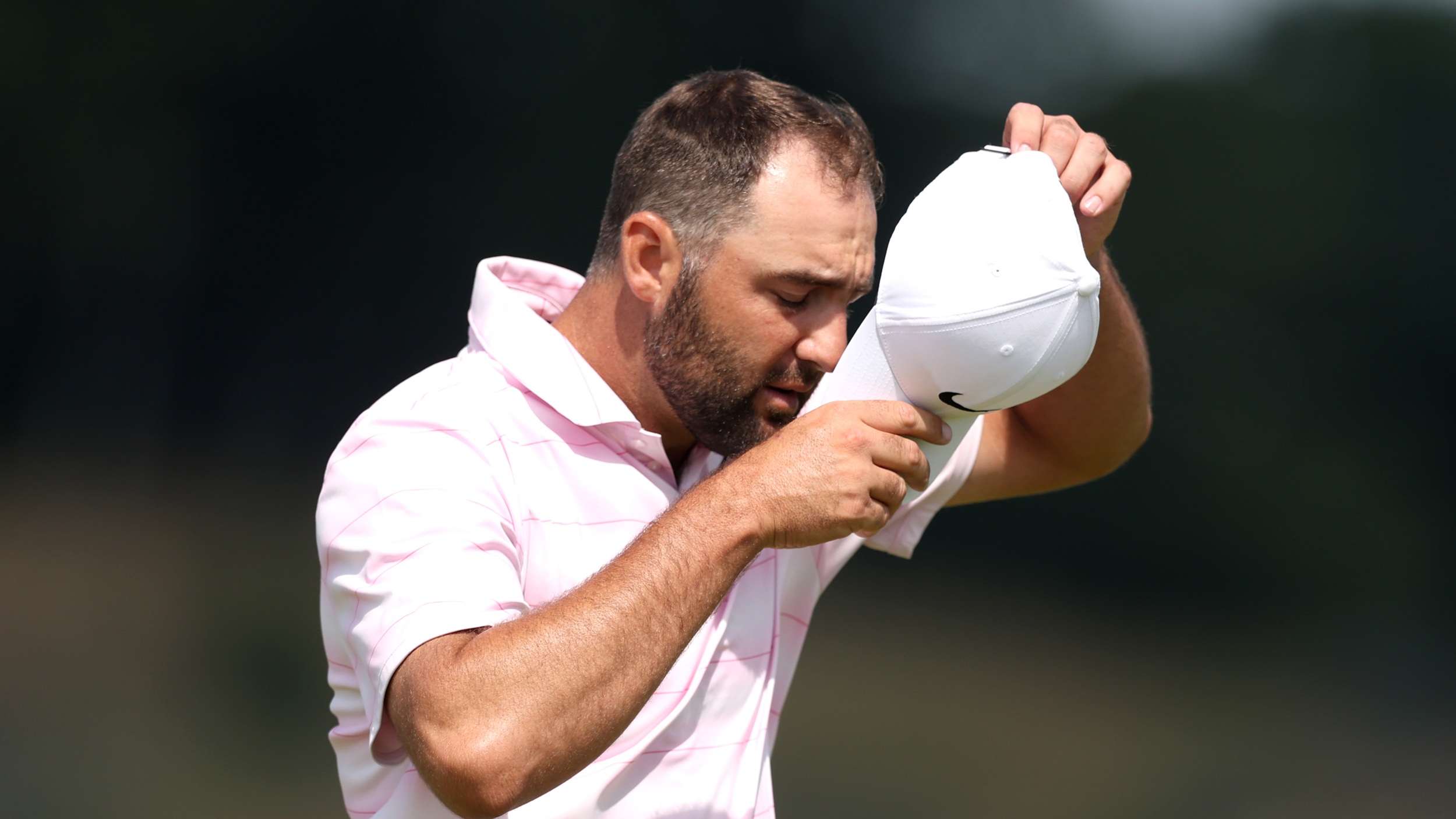 Scottie Scheffler takes off his cap after missing the cut at the Genesis Scottish Open