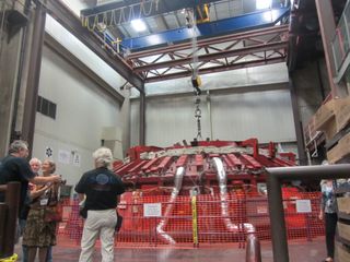 The third primary mirror for the Giant Magellan Telescope is cast in a spinning furnace at the University of Arizona's Steward Observatory Mirror Lab on Aug. 23, 2013.