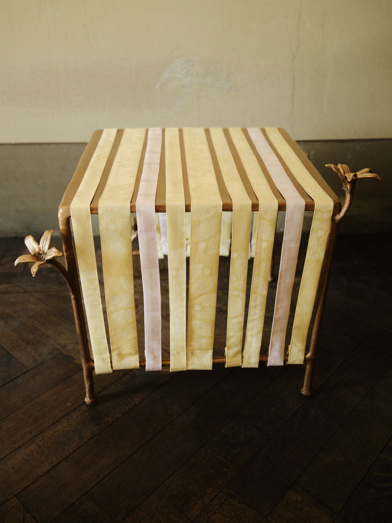bronze furniture draped in pastel ribbons
