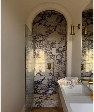 Small bathroom with marble shower
