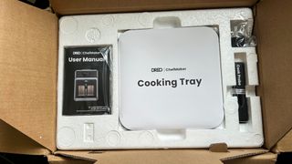 Dreo ChefMaker Combi Fryer is packed in a box with styrofoam protection