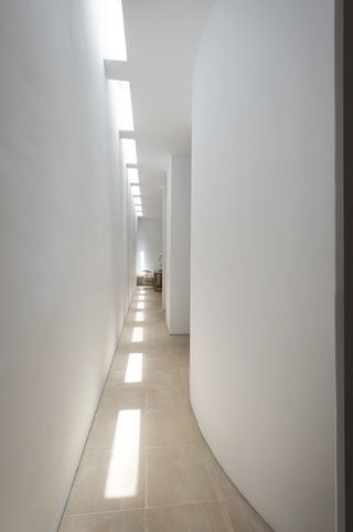 white hallway with curved wall