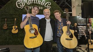 ANAHEIM, CALIFORNIA - JANUARY 22: (L-R) C.F. Martin & Co. President and CEO Thomas Ripsam, musician Peter Frampton, and C.F. Martin & Co. Executive Chairman Chris Martin pose at the C.F. Martin & Co. booth during Global Media Day at The NAMM Show 2025 at Anaheim Convention Center on January 22, 2025 in Anaheim, California. (Photo by Daniel Knighton/Getty Images)