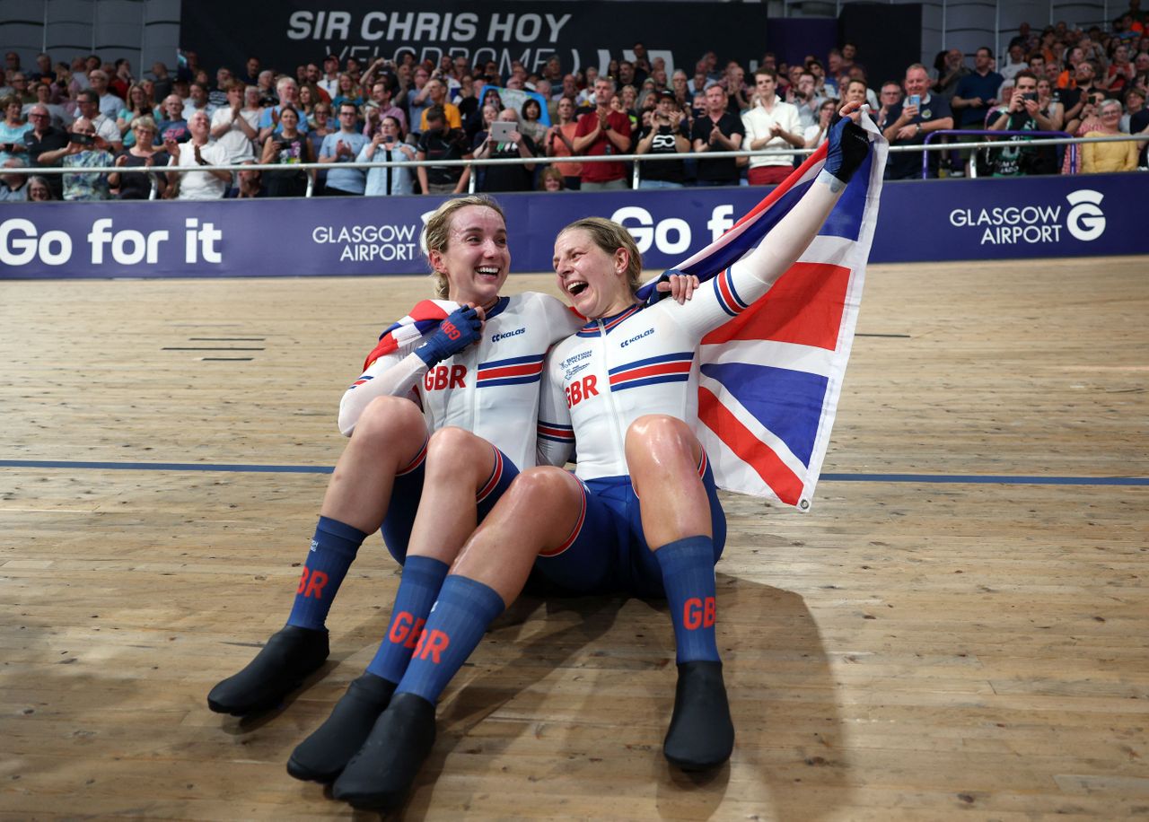 Neah Evans and Elinor Barker sitting on the track 