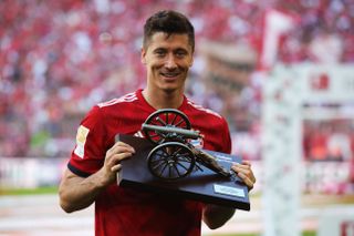 Bayern Munich striker Robert Lewandowski with the award for the Bundesliga's top scorer in 2018.