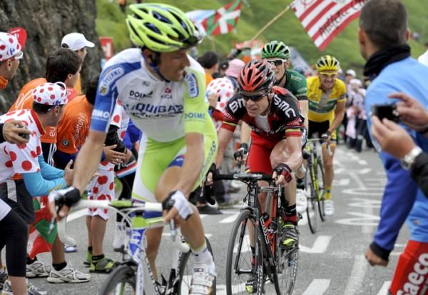 Basso asks Evans to come through for another pull on the climb to the line.