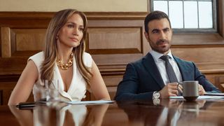 (L-R) Jennifer Lopez as Jackie Cruz and Brett Goldstein as Daniel Blanchflower in "Office Romance" on Netflix