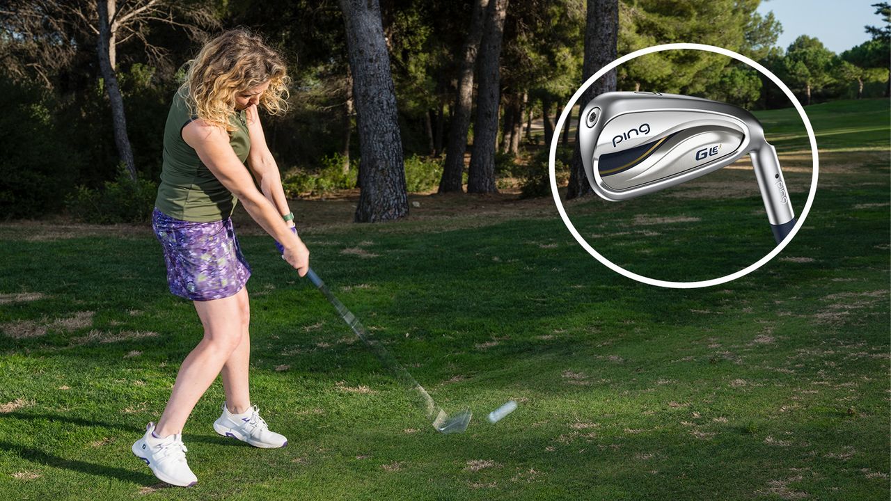 Female golfer hitting a 7-iron