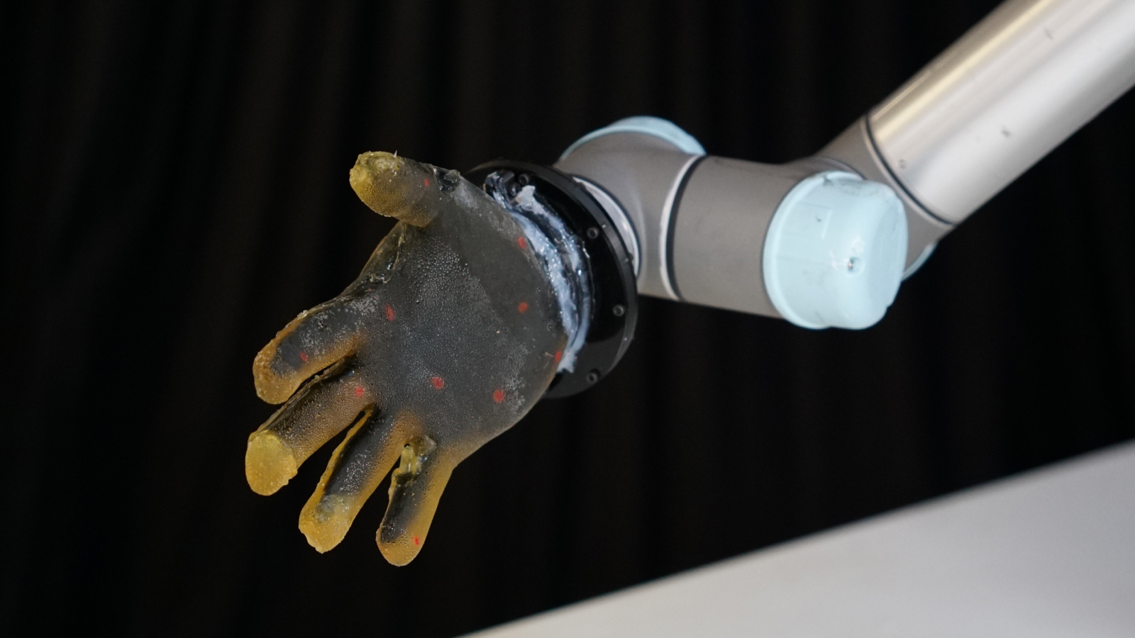 Image of robot hand with the new 'skin' material.