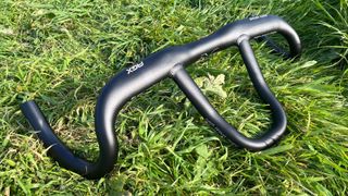 FSA Pro Wing AGX loop gravel handlebar pictured on grass