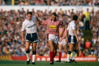 20 October 1990 - English Football League Division One - Tottenham Hotspur v Sheffield United - Paul Gascoigne of Tottenham is given a helping hand by Vinnie Jones of United. (Photo by Mark Leech/Getty Images)