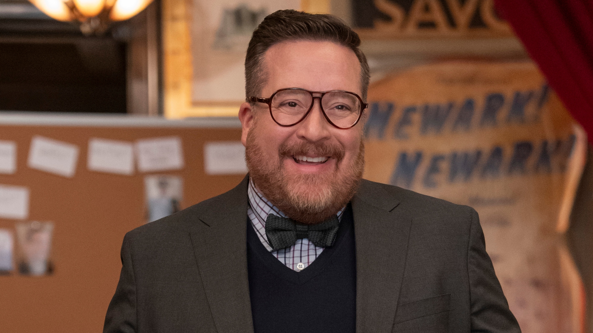 Michael Cyril Creighton in a bow tie and grey jacket as Howard in Only Murders in the Building