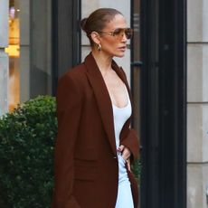 Jennifer Lopez wearing a brown blazer