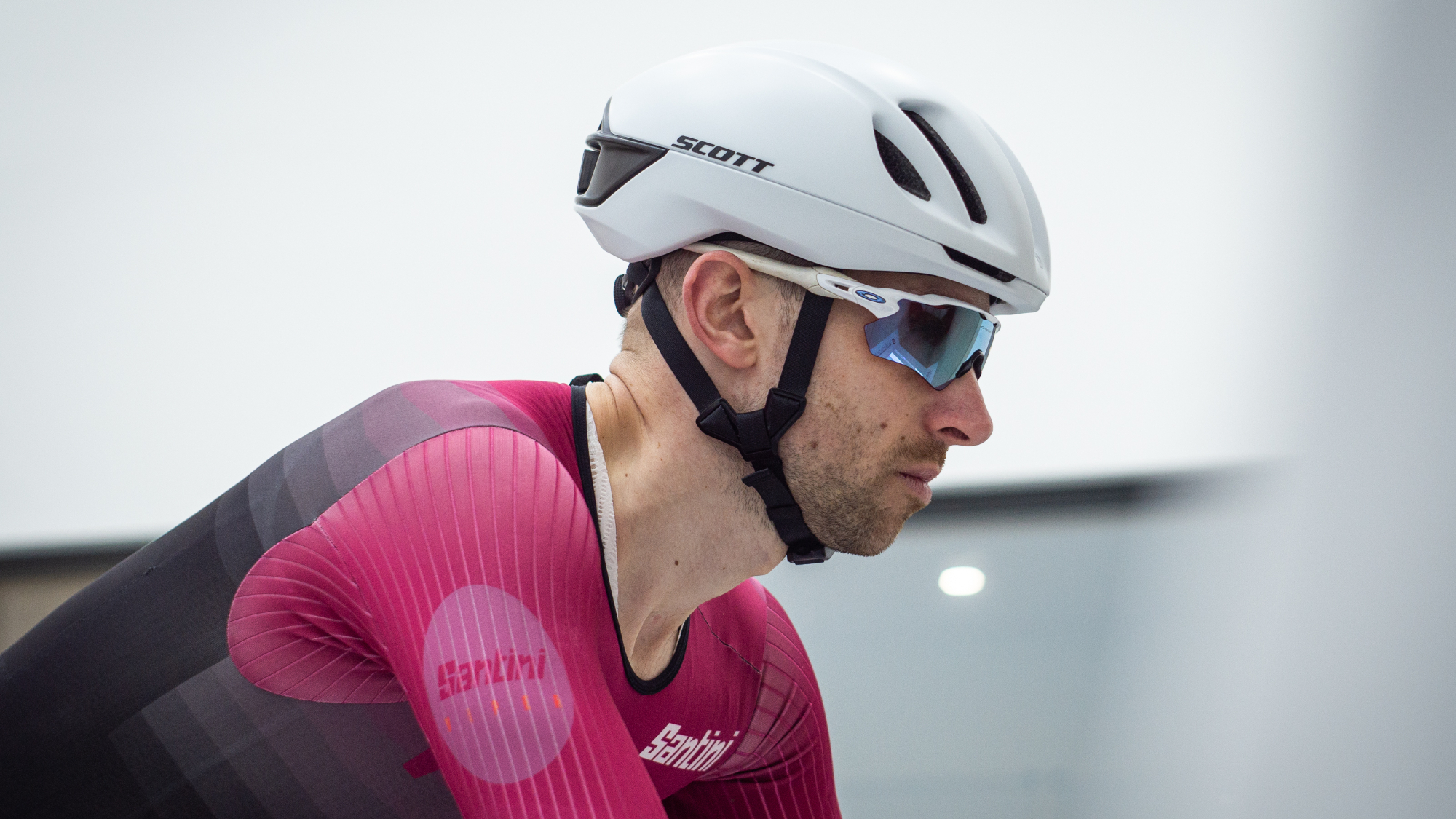 Tom riding in the wind tunnel wearing an aero helmet