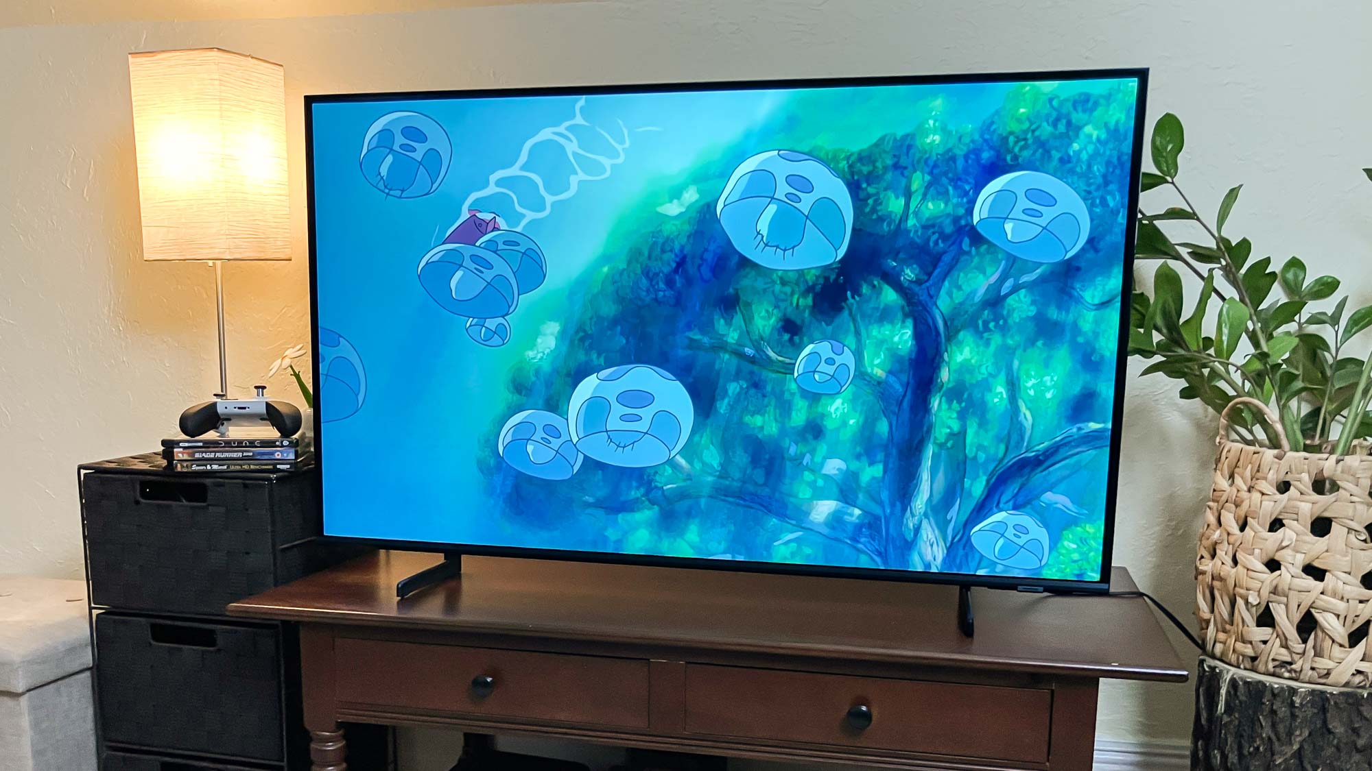 Samsung Q60D QLED TV on console in living room