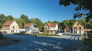 custom build site with four different houses in shot