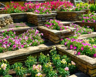 stone wall with flowerbeds