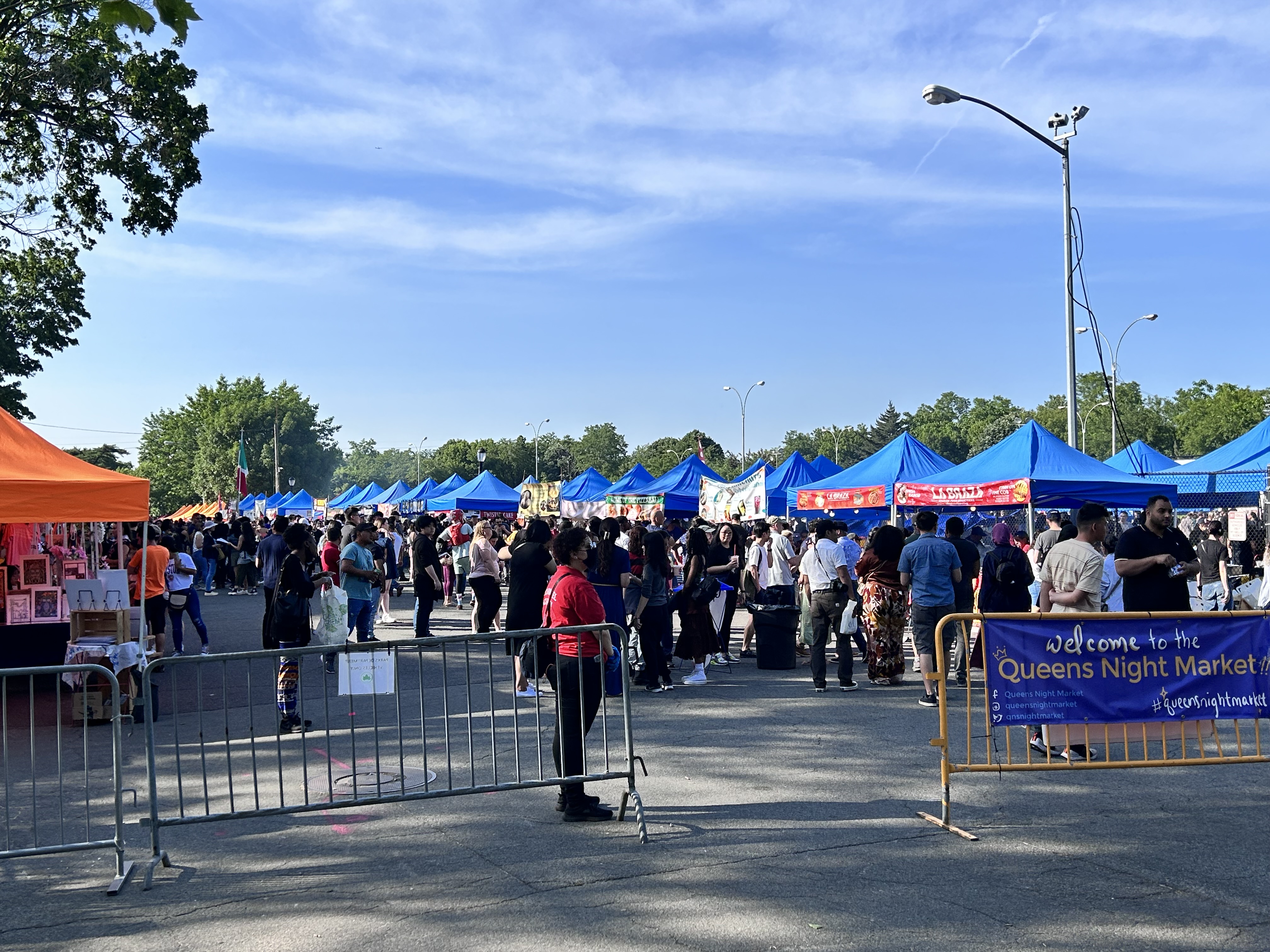 People line up for food at the Queens Night Market