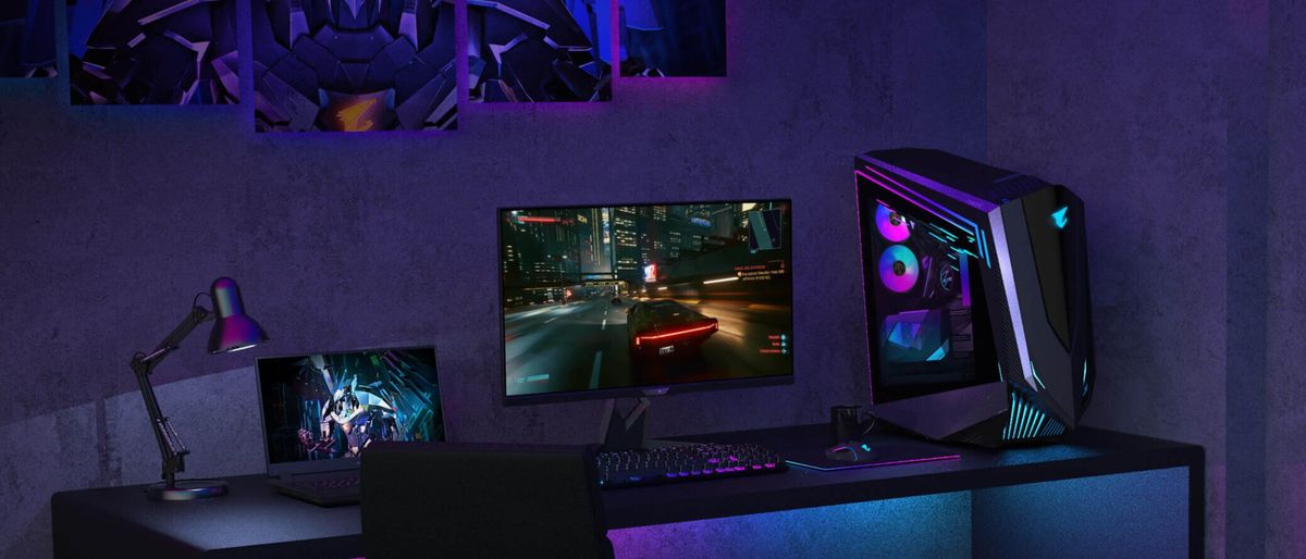 Gigabyte Aorus FI32U gaming setup on desk