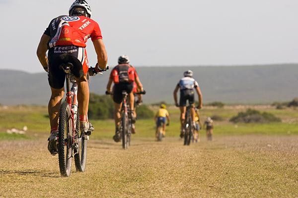 The men race during stage five.